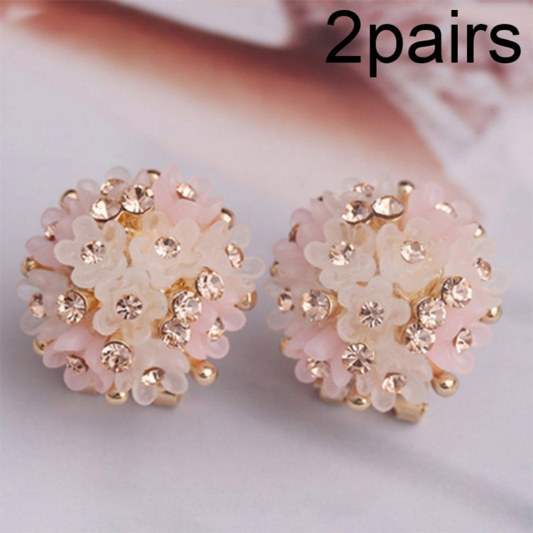 Pink-and-white crystal flower stud earrings with gold-tone posts, domed petals.