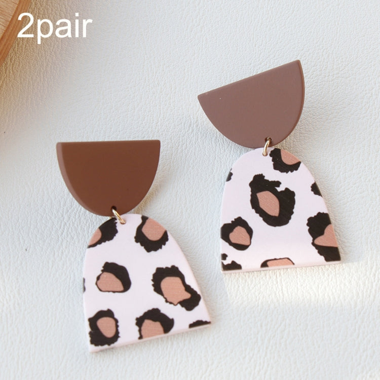 Acrylic clay dangle earrings, white with black-and-brown spots and brown caps