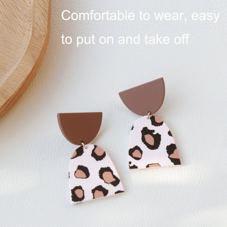 Acrylic clay dangle earrings with brown caps and cow-print style white panels