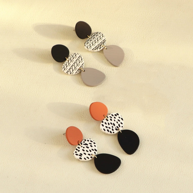 Assorted dangle earrings with leopard print and solid black drops, plus gray accents