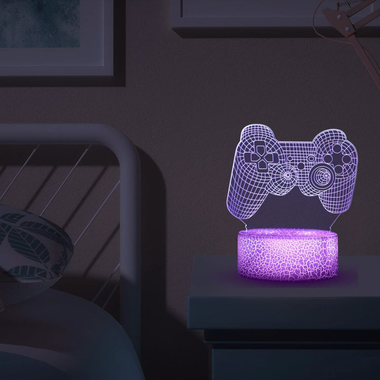 Purple glowing game controller LED light on bedside table