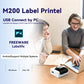 Handheld label printer near a laptop for PC label printing