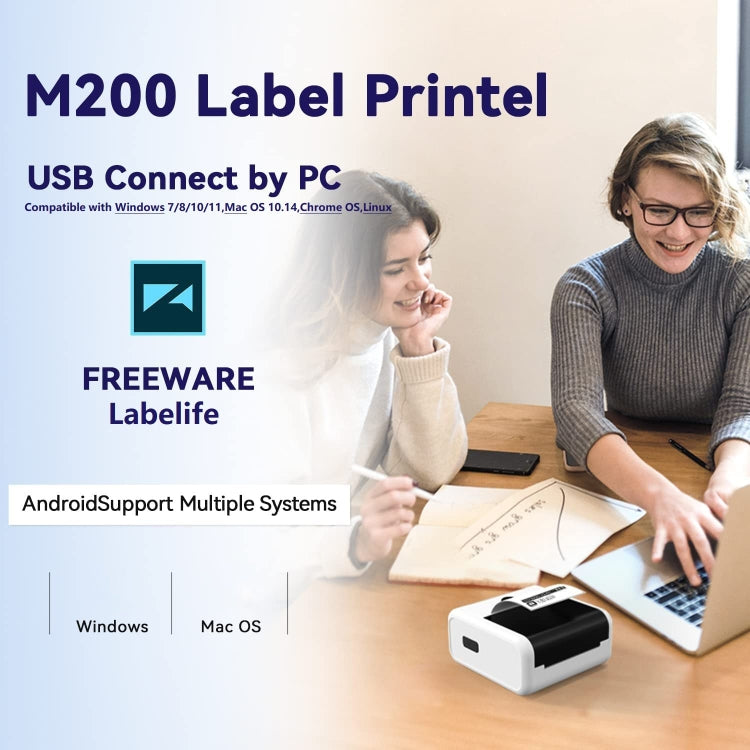 Handheld label printer near a laptop for PC label printing