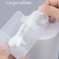 Hand squeezing a clear refillable squeeze pouch with large-cap spout