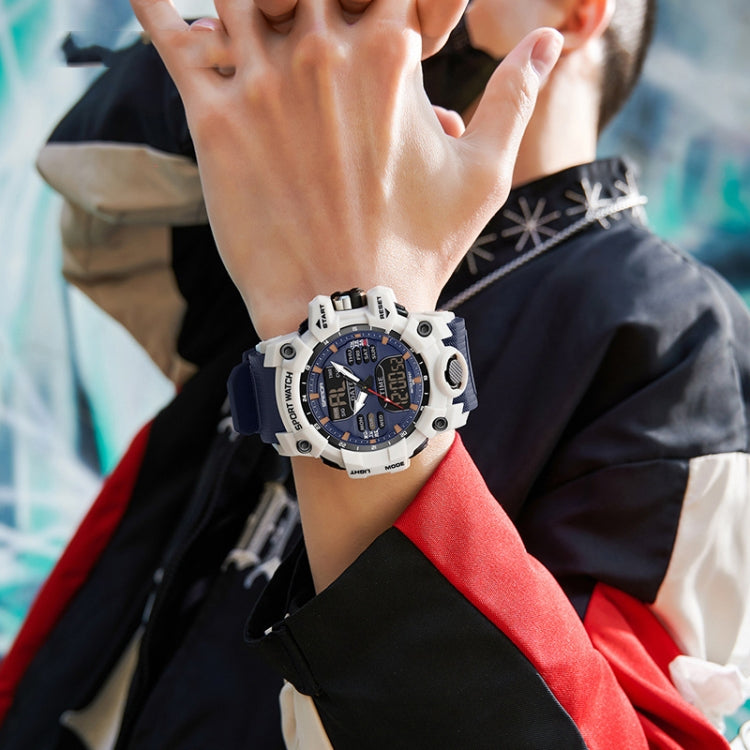 White sport watch on wrist with blue dial and black bezel