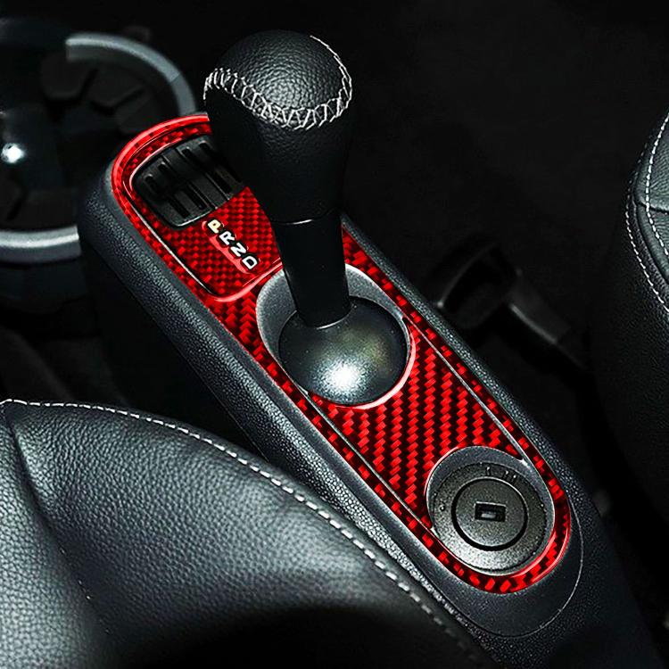Red carbon-fiber gearshift sticker set installed on center console trim around shifter