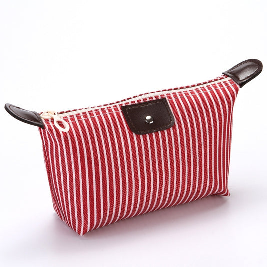 Red striped folding cosmetic bag with zipper and brown leather-look corner accents