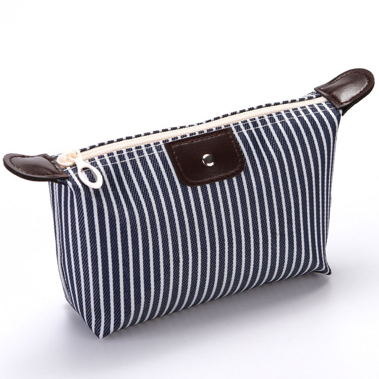 Navy striped folding cosmetic bag with zipper closure and brown leather-look patch