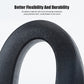 Black flexible car seat gap filler plug, textured surface close-up.