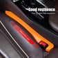 Car seat gap plug in orange with red latch beside center console
