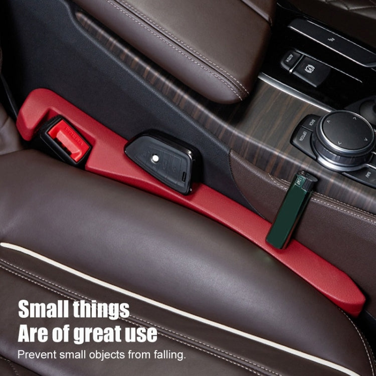 Car seat gap plug with red cover and black base in car seat gap