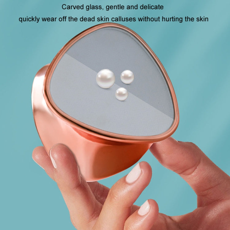 Rose gold foot peeling grinder head with gray textured surface and raised rim