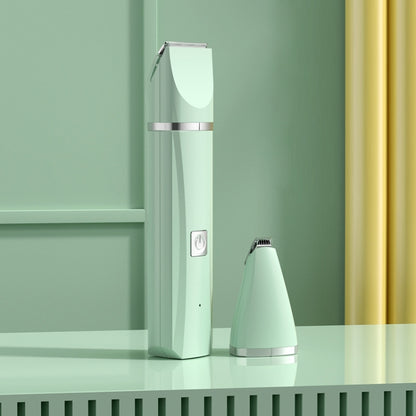 Green electric pet hair clipper with cone grooming attachment on base
