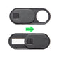 Car camera privacy sticker cover, dark oval panel with round cutout