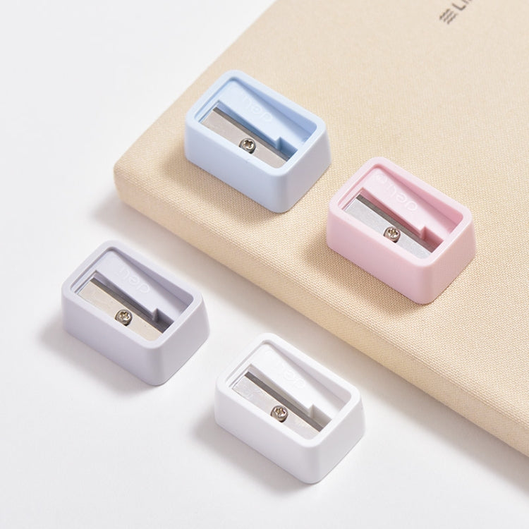 Set of mini pencil sharpeners, blue and pink plastic bodies with exposed cutting blades