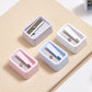 Mini pencil sharpeners set with blue, pink, and white plastic housings and metal blades