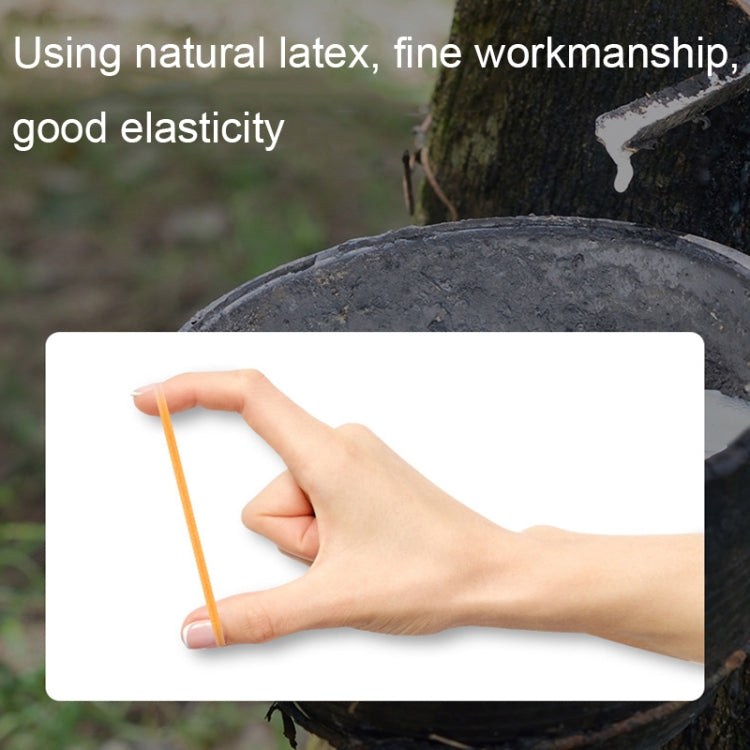 Yellow rubber band stretched by hand between fingers