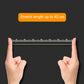 Yellow rubber band stretched across a ruler for length measurement