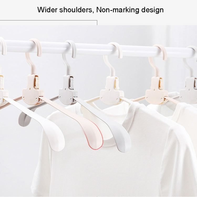 Wide-shoulder plastic hangers on a drying bar, non-marking curved design
