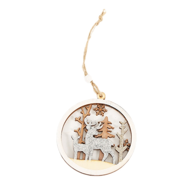 Round wooden Christmas pendant with deer, trees, and village scene; hanging on twine string