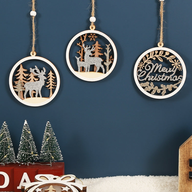 Three round wooden Christmas pendants hanging from twine strings; deer and “Merry Christmas” designs