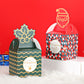 Green wave Christmas candy box and red geometric Christmas candy box with ornament toppers