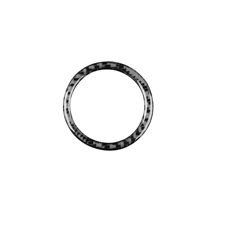 Black carbon-fiber style headlight switch ring decorative sticker.