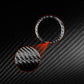 Black and red carbon-fiber headlight switch ring stickers (pair).