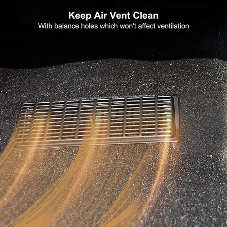 Installed under-seat vent cover, black rectangular grille insert with airflow openings