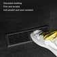 Under-seat vent cover with black rectangular grille, shown under a sneaker