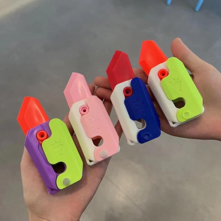 Colorful gravity decompress toy fidget pieces held in hand: pink, blue, green, purple