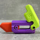 Purple and lime gravity decompress fidget toy with hinged wheel and side slot