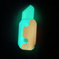 Glowing teal night-light gravity decompress toy with cutout handle shape