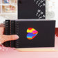 Black scratch art notebook pages with spiral binding and colored scratch pen tip