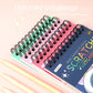 Colorful upturned coil scratch art notebook with spiral binding and multicolor cover