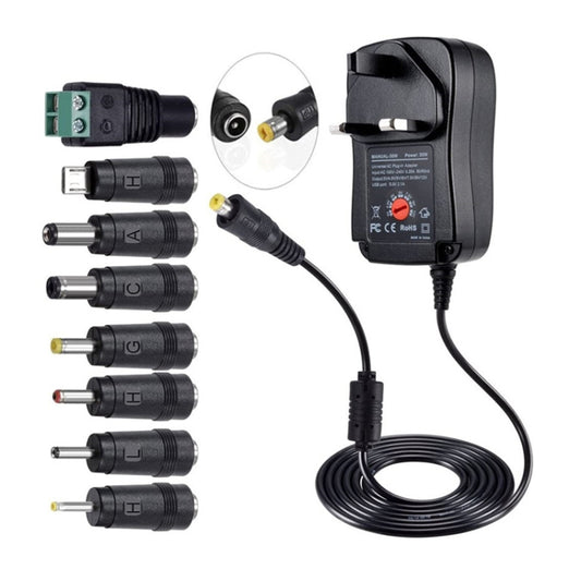 Black power adapter with adjustment dial, cable, and assorted DC barrel connectors