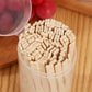 Bamboo two-tine dessert forks in a clear plastic can