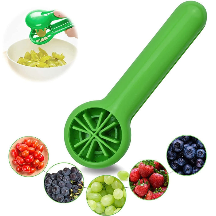 Green handheld fruit slicer with slicing grid head and curved grip handle