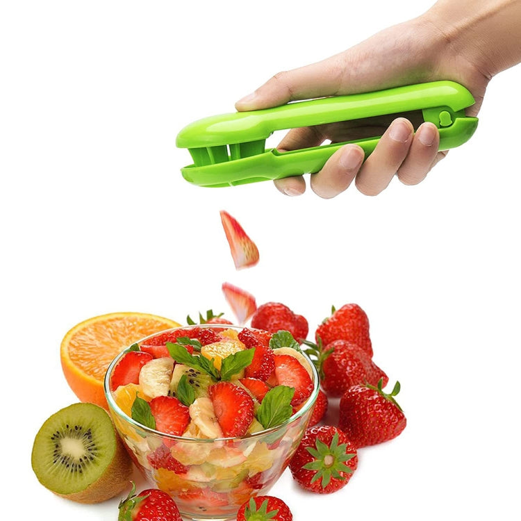 Green handheld fruit slicer held above chopped fruit