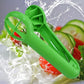 Green fruit slicer tool spraying into water with splashes
