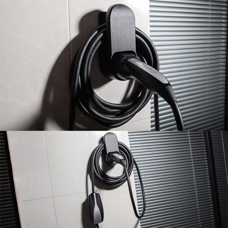 EV charger wall bracket holding plug and cable near exterior wall