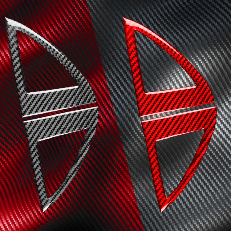 Close-up of red and black carbon-fiber inner A-pillar speaker cover with triangular cutout