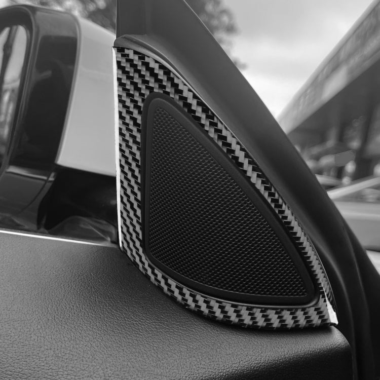 Installed inner A-pillar speaker cover with black carbon-fiber trim and grille mesh
