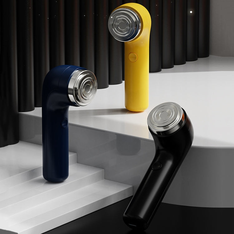 Three electric shavers in yellow, blue, and black with round shaving heads
