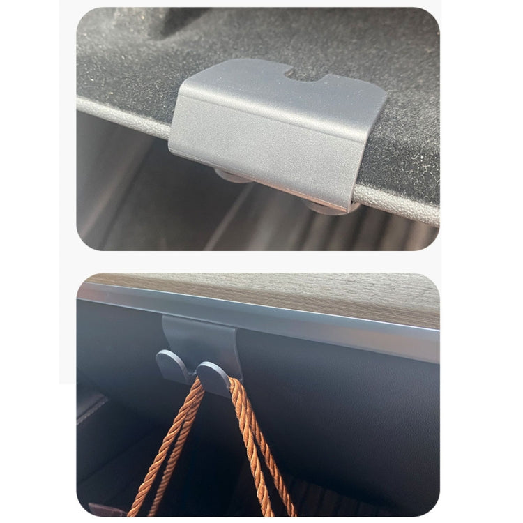 Gray glove box hook piece and installed clip on glove box ledge