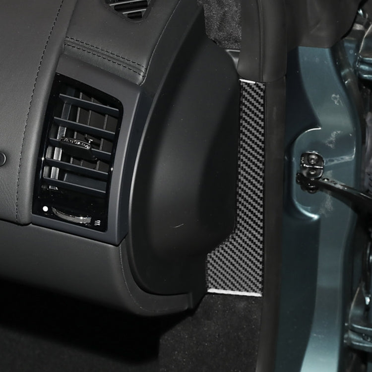 Black carbon-fiber door side panel trim sticker beside dashboard vent