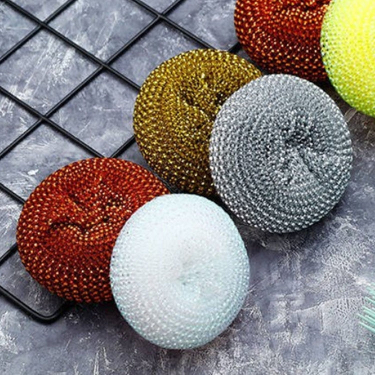 Wire dish scrub balls with colored tops: white, red, gold, and gray on a rack