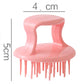 Pink dish scrub brush with gray steel abrasive ball and comb-like plastic handle