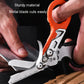 Close-up of foldable multitool scissors cutting with metal blades and a ruler scale