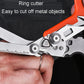 Close-up of orange-handled foldable scissors cutting along a small ruler scale